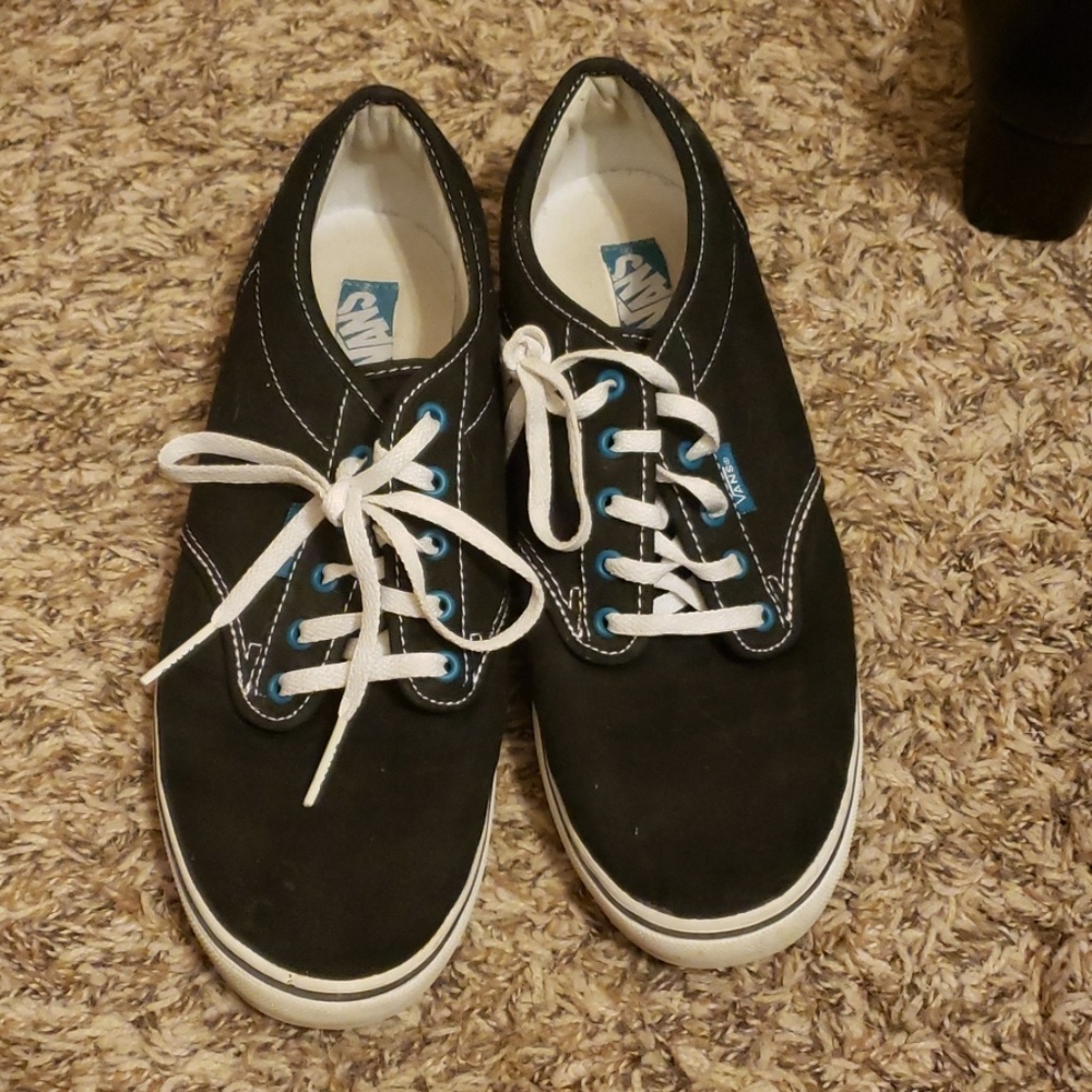 Vans Black with teal stripe.